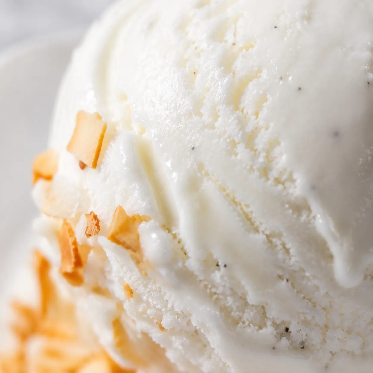 Macro close-up of creamy coconut cream ice cream scoop
