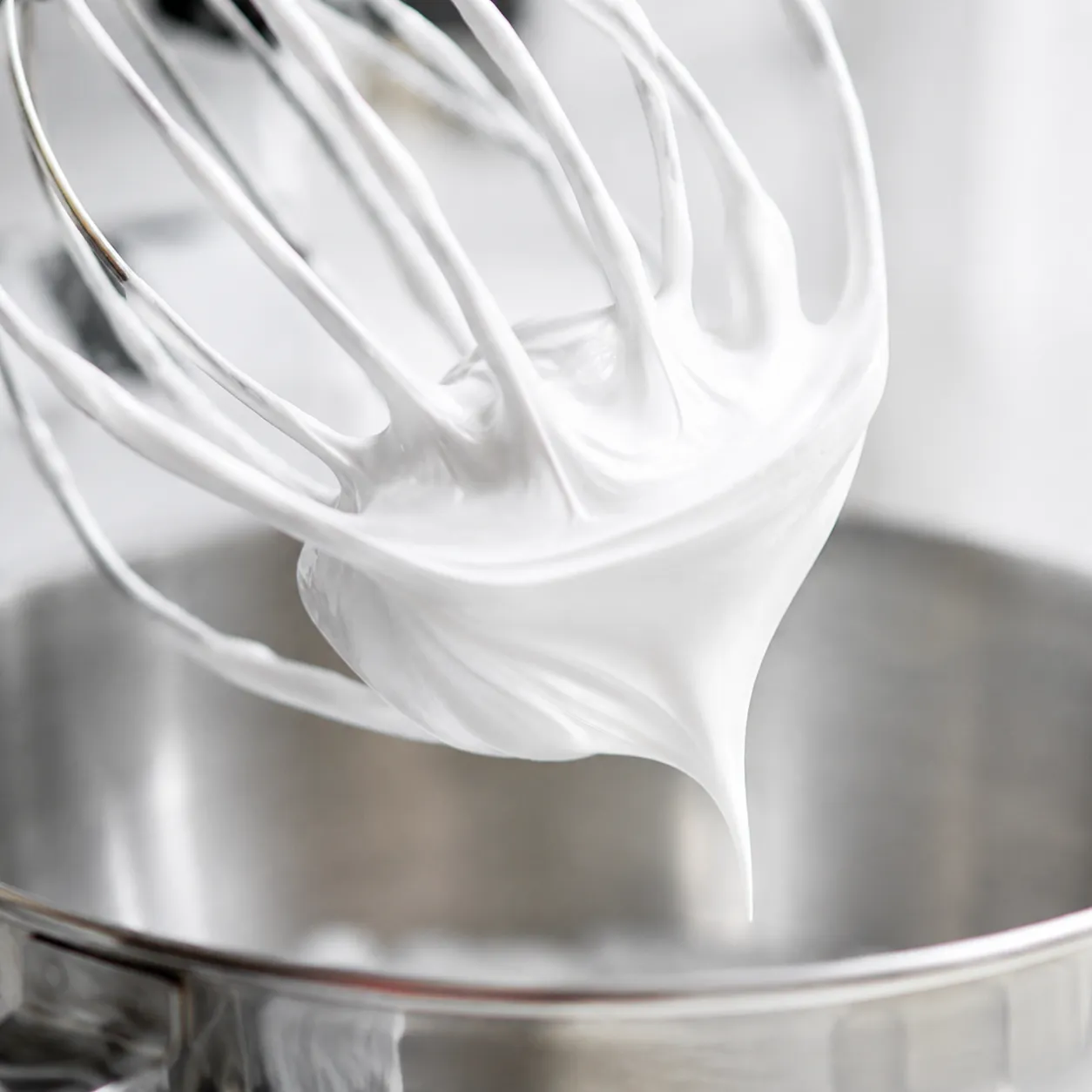 Glossy meringue stiff peaks for baked alaska topping