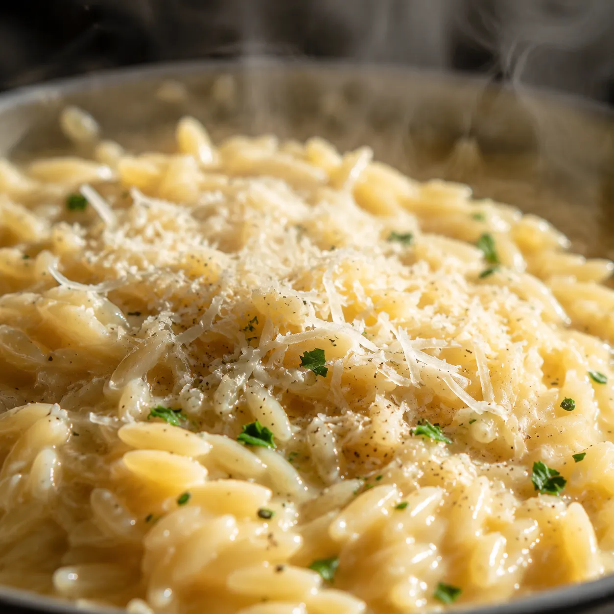 Creamy orzo recipe with Parmesan melting into the sauce