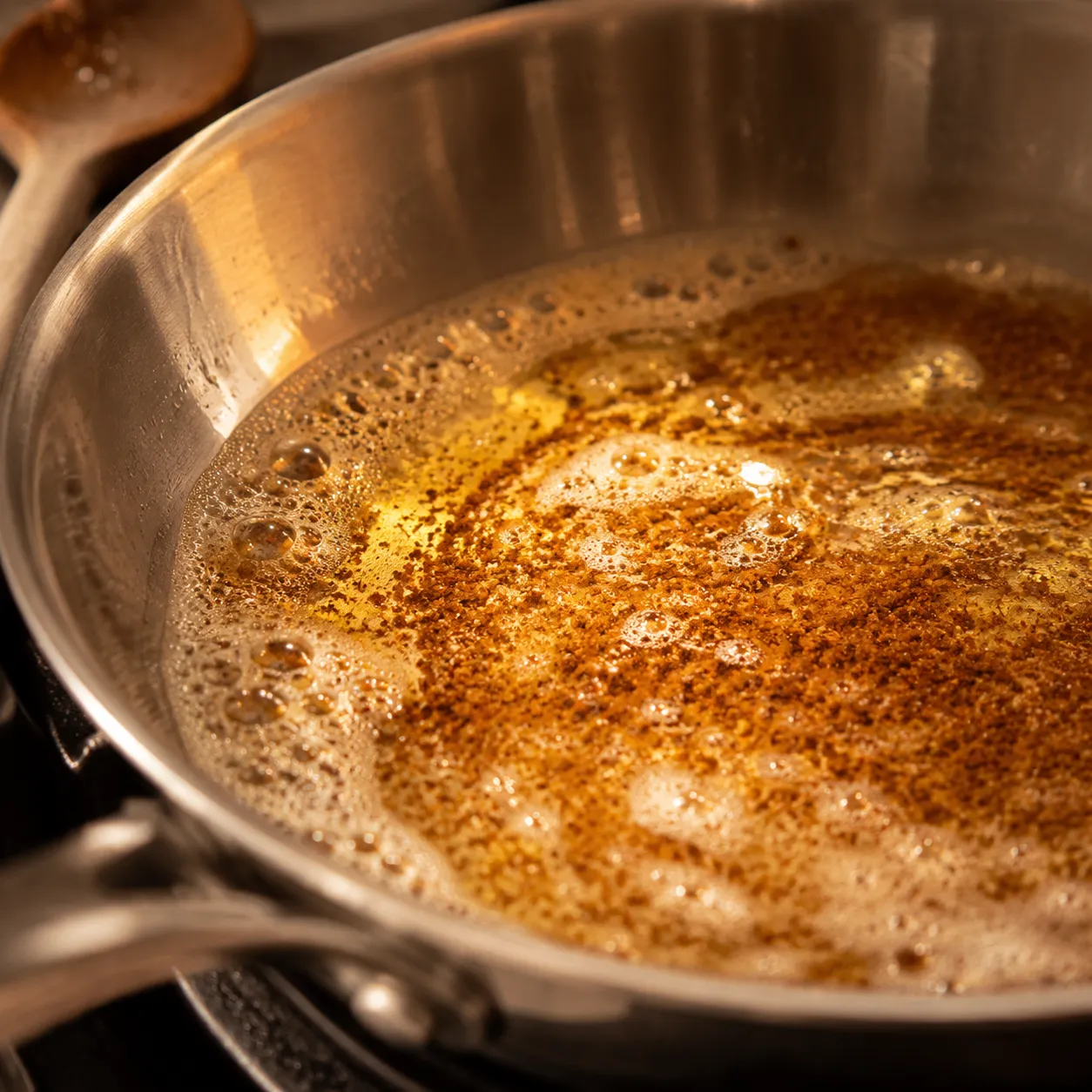 Brown butter foaming and turning amber in a skillet for campanelle sauce