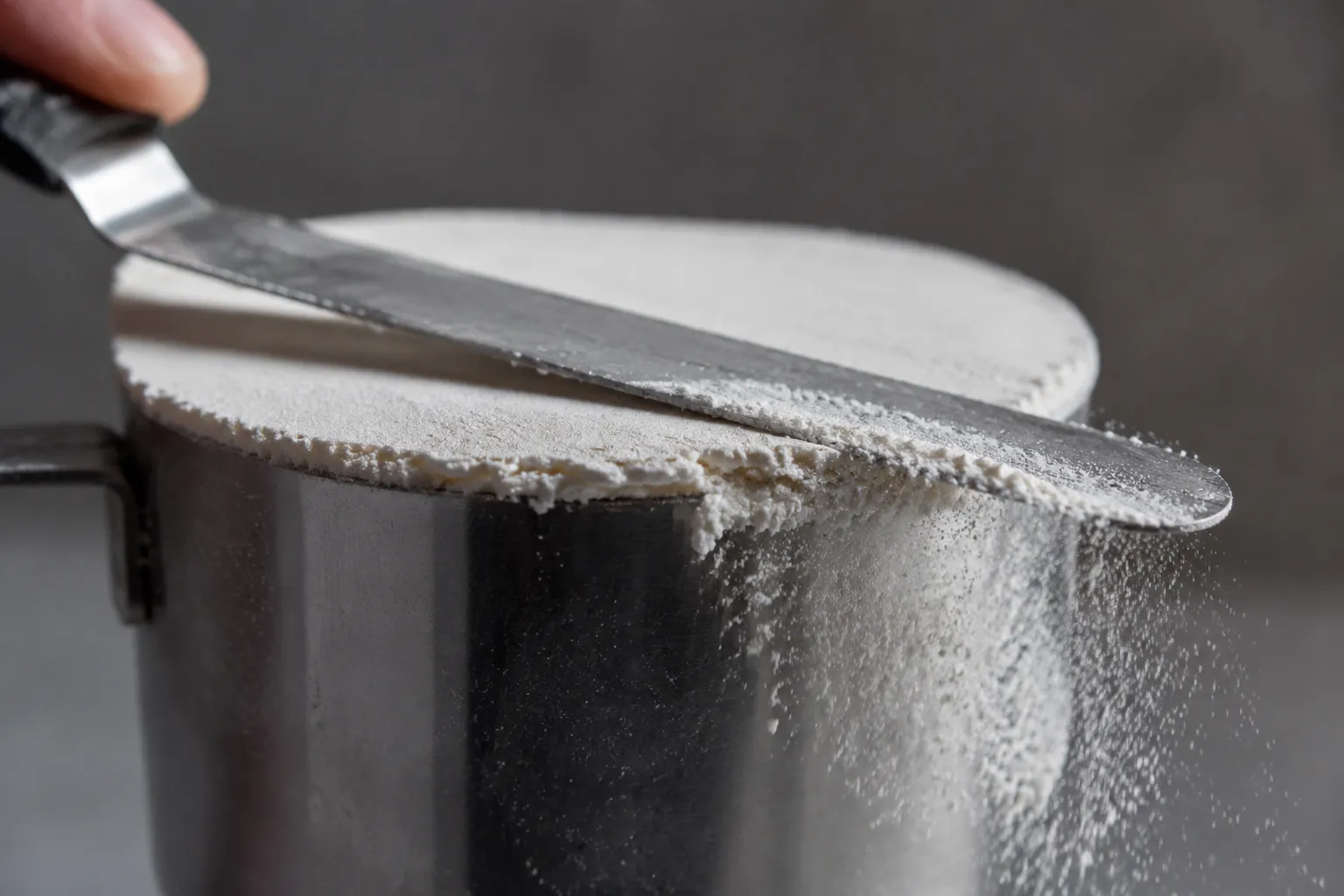 Leveling 1 cup of flour for accurate cup to gram conversion