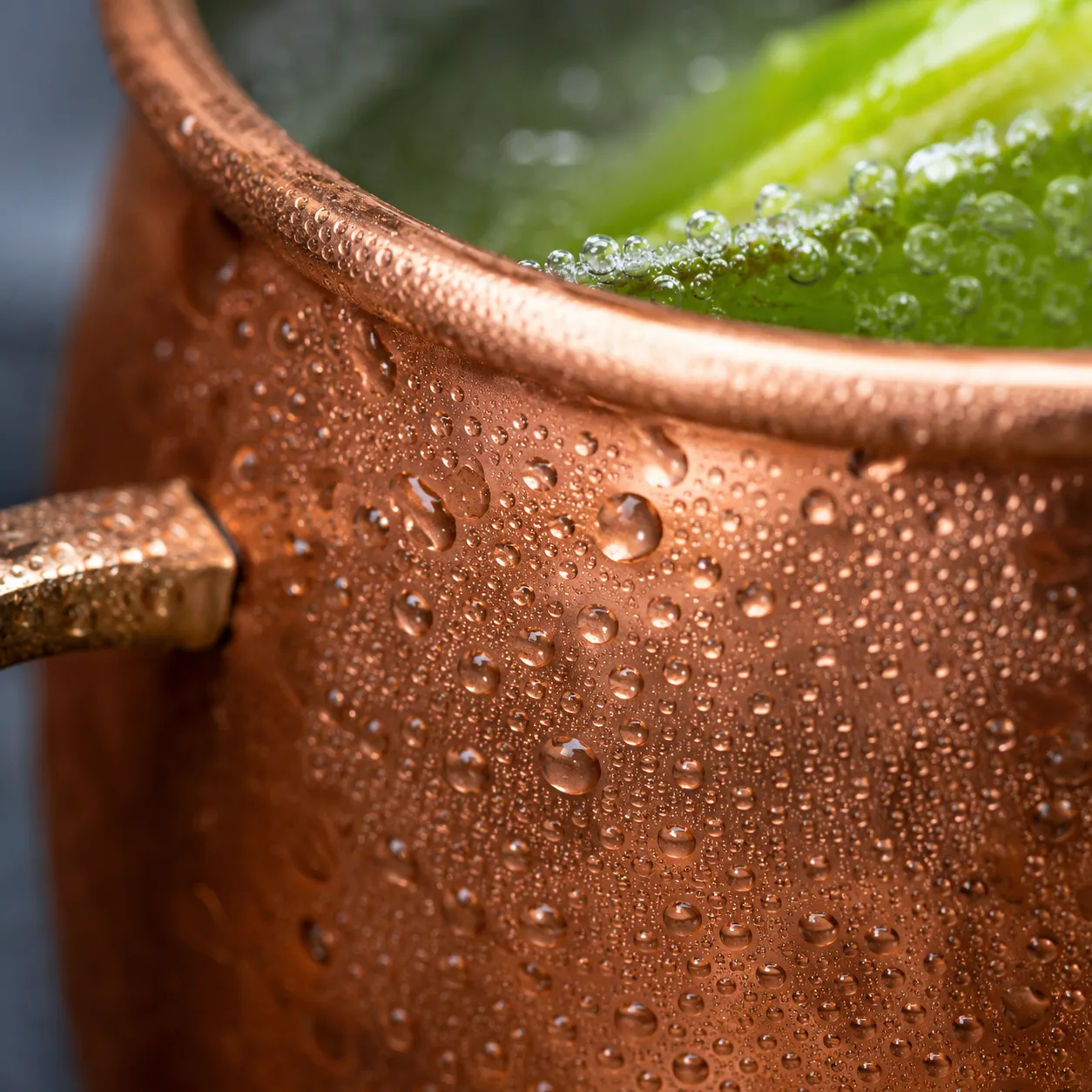 Macro close-up of condensation on a copper mug Moscow mule