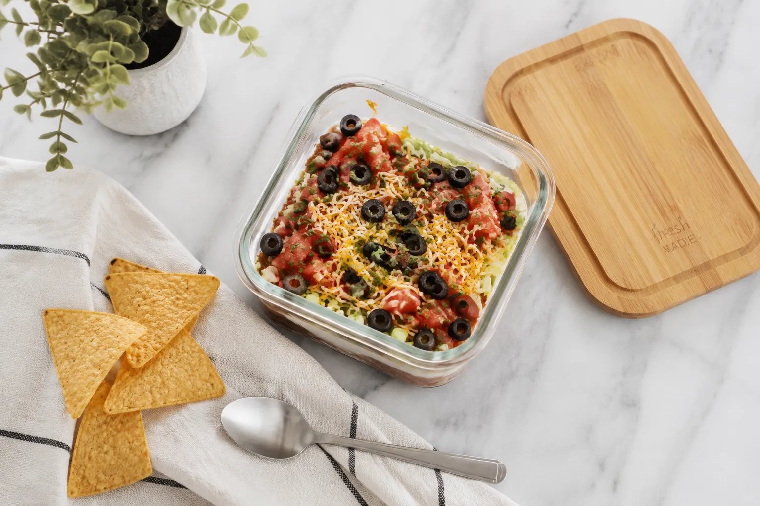 Storing leftover taco dip in a glass container