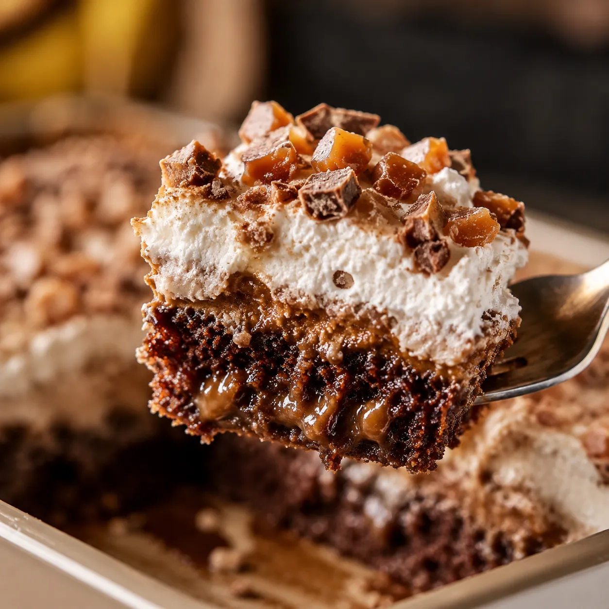 Macro forkful of better than sex cake showing caramel and whipped layers