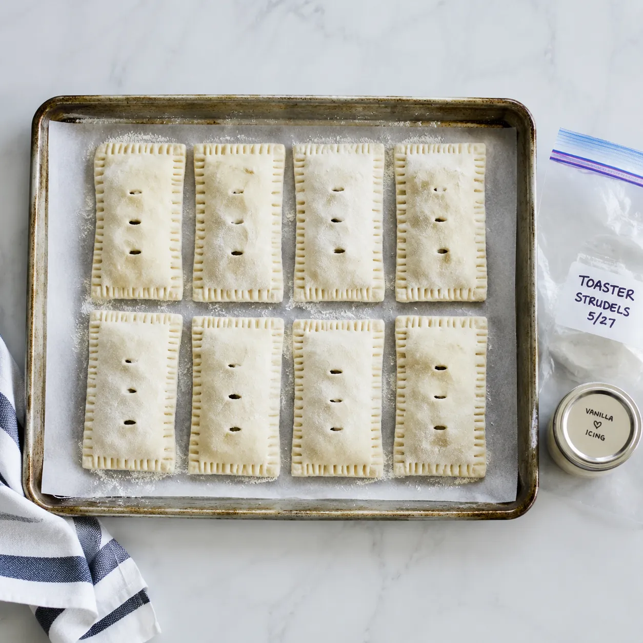Make-ahead toaster strudels arranged on a tray for freezing