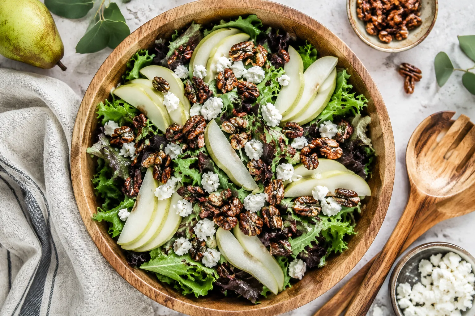 Candied pecans on a fall salad with pears and goat cheese