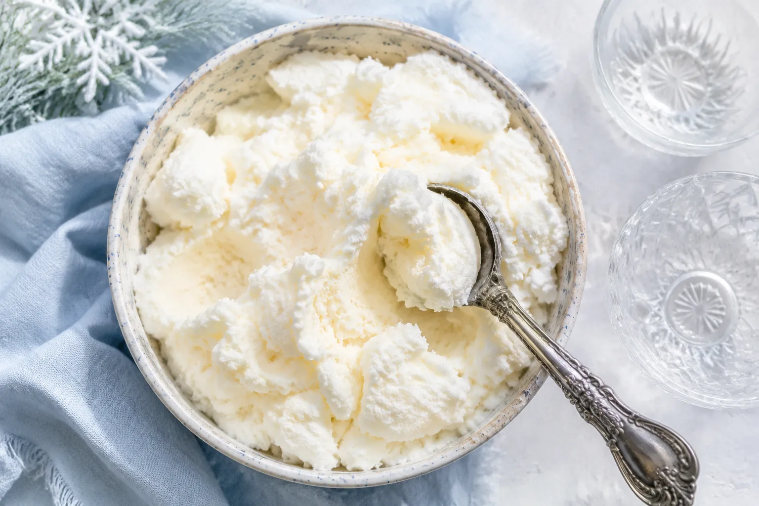 Finished snow cream recipe in a ceramic bowl with ice cream scoop