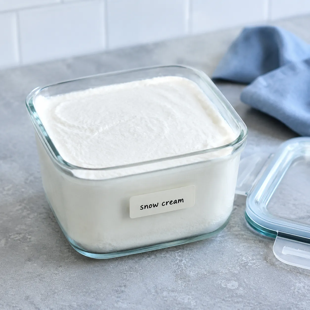 Storing leftover snow cream in a glass freezer container