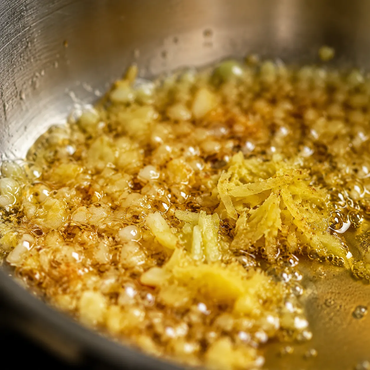 Garlic and ginger sizzling in sesame oil for general tso sauce