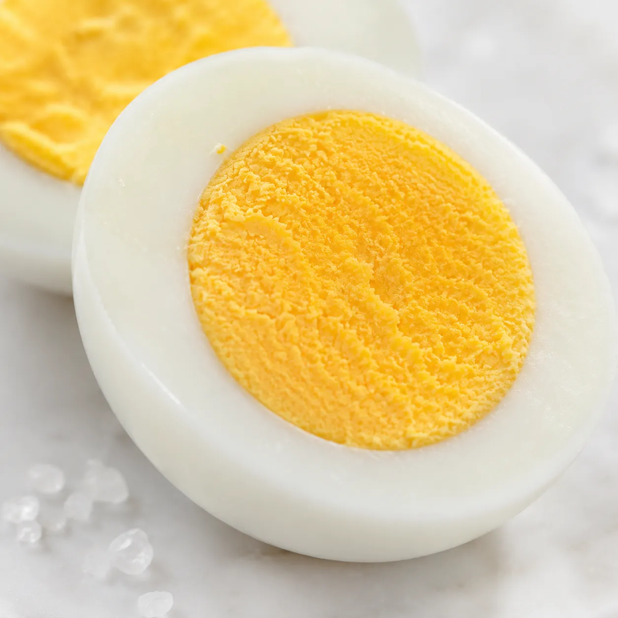 Close-up of air fryer hard boiled eggs with firm golden yolks