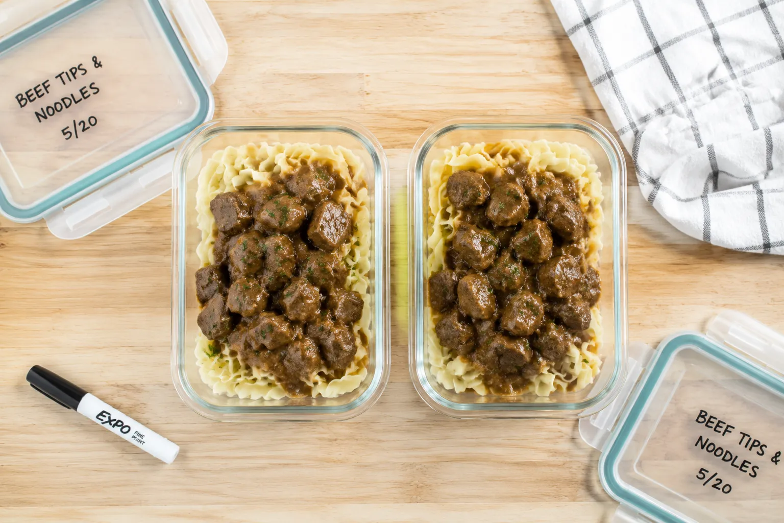 Leftover beef and noodles stored in glass meal-prep containers.