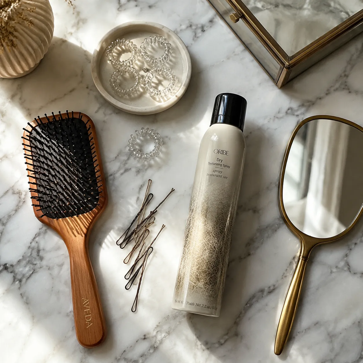 Tools needed for fishtail braid: brush, elastics, texture spray