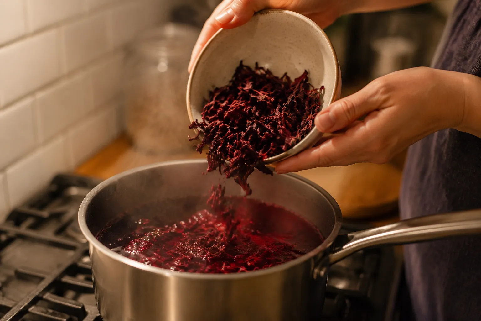 Simmering dried hibiscus flowers to make jamaica drink