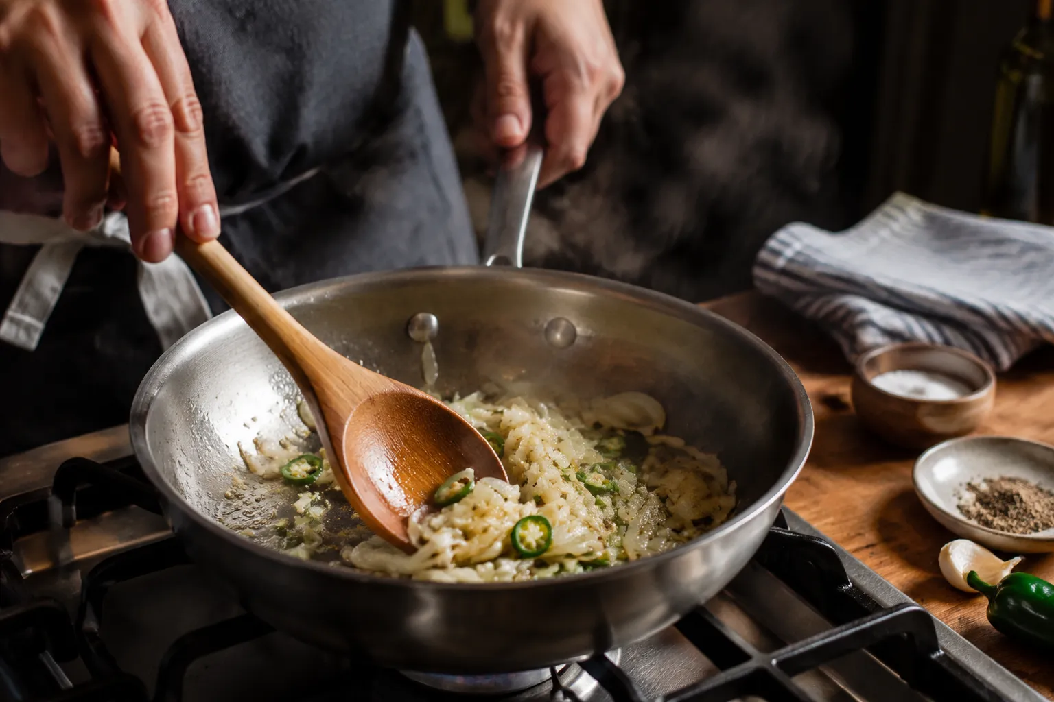 Sautéing onion, garlic, and jalapeño for refried beans recipe