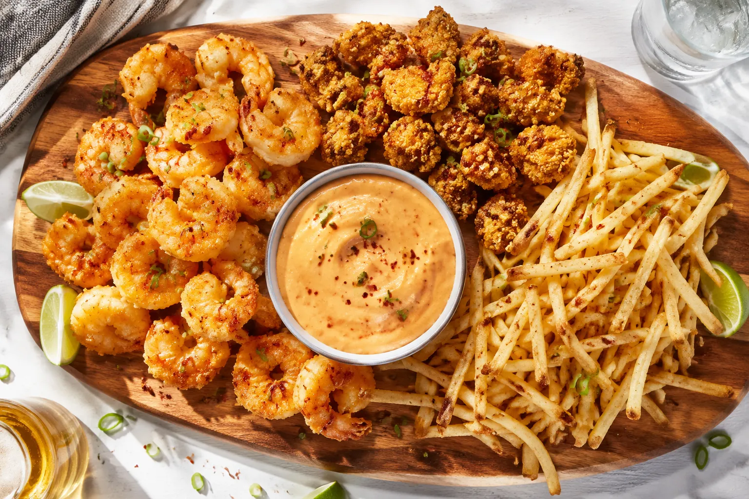 Bang bang sauce served with crispy shrimp, chicken, and fries