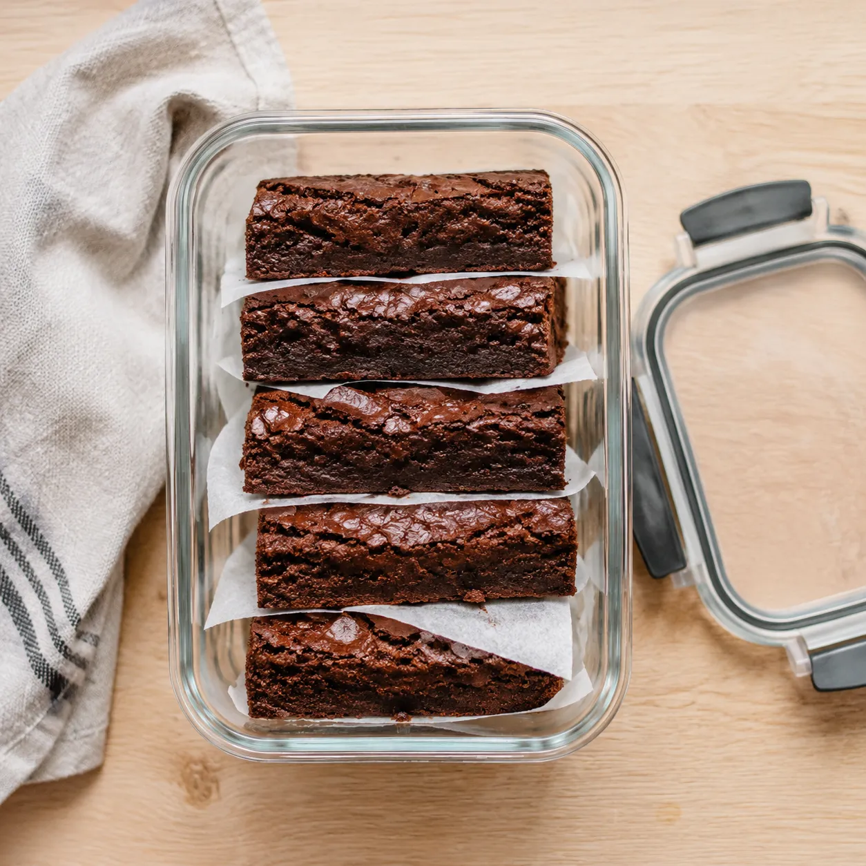 Storing fudgy sweet potato brownies in a glass container