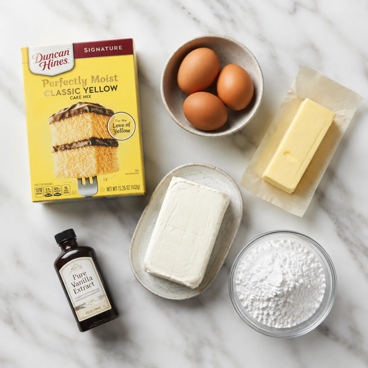 Neiman Marcus cake ingredients flatlay with cake mix cream cheese and powdered sugar