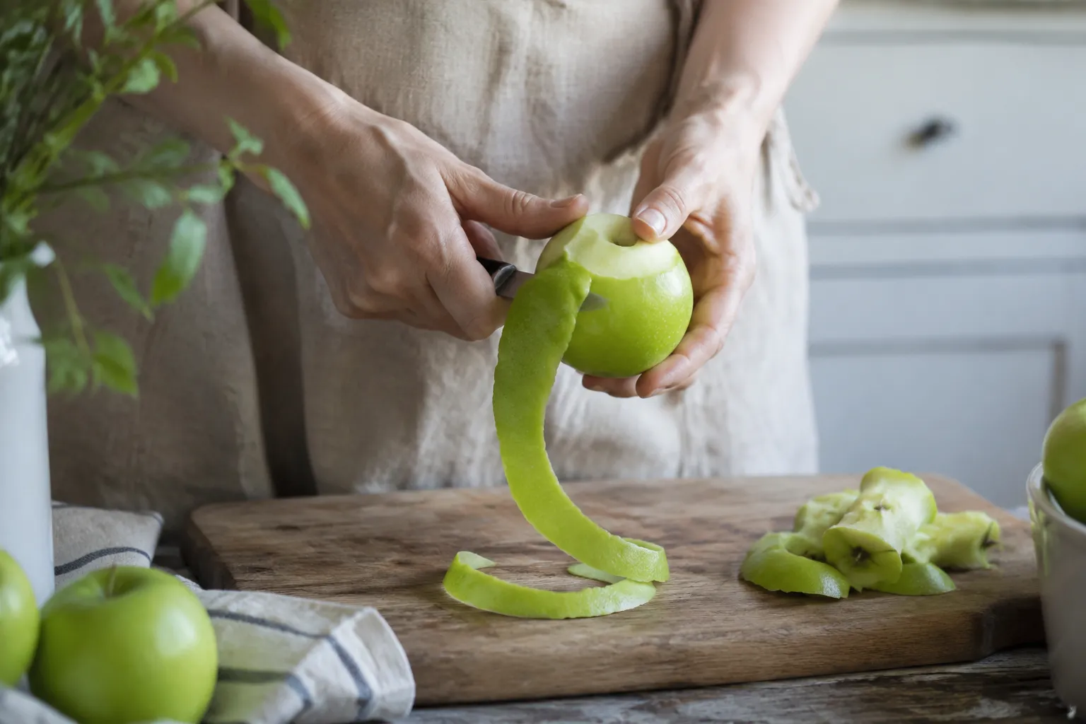 Peeling Granny Smith apples for homemade apple dumplings