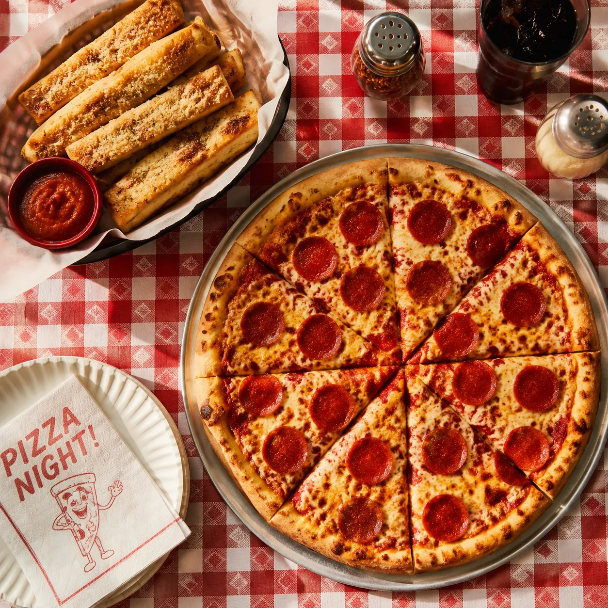Homemade copycat little caesars pizza and crazy bread on a table