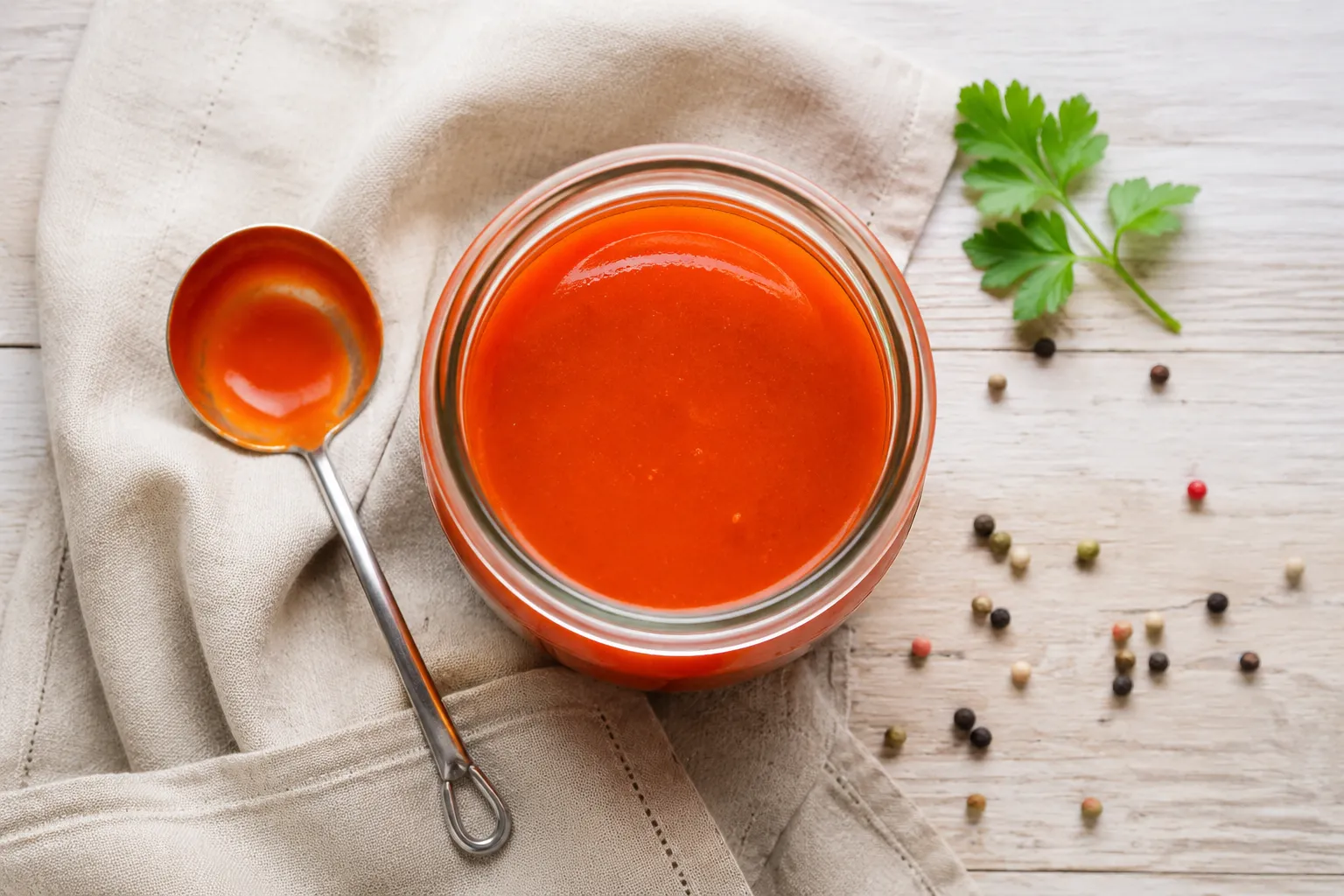 Finished homemade buffalo sauce recipe in a glass jar.