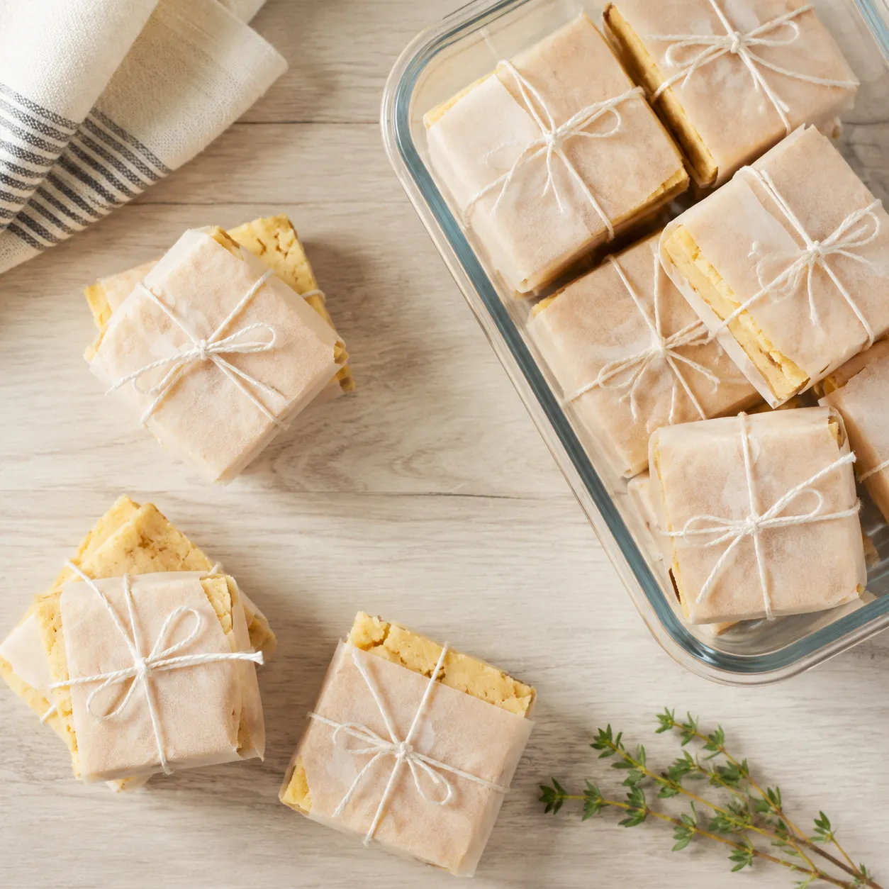 Gluten free cornbread squares wrapped in parchment for freezing and storage