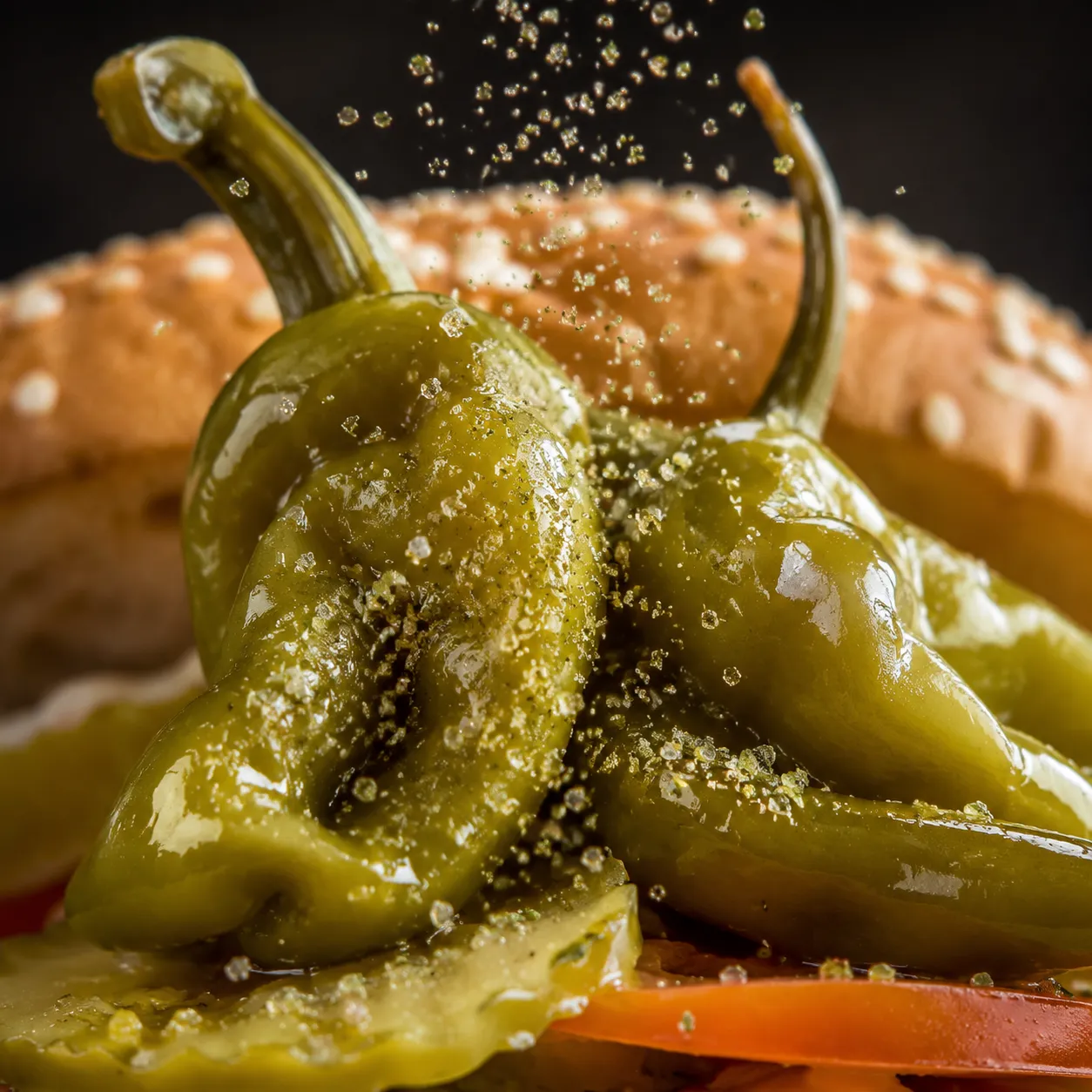 Sport peppers and celery salt finishing a Chicago hot dog recipe