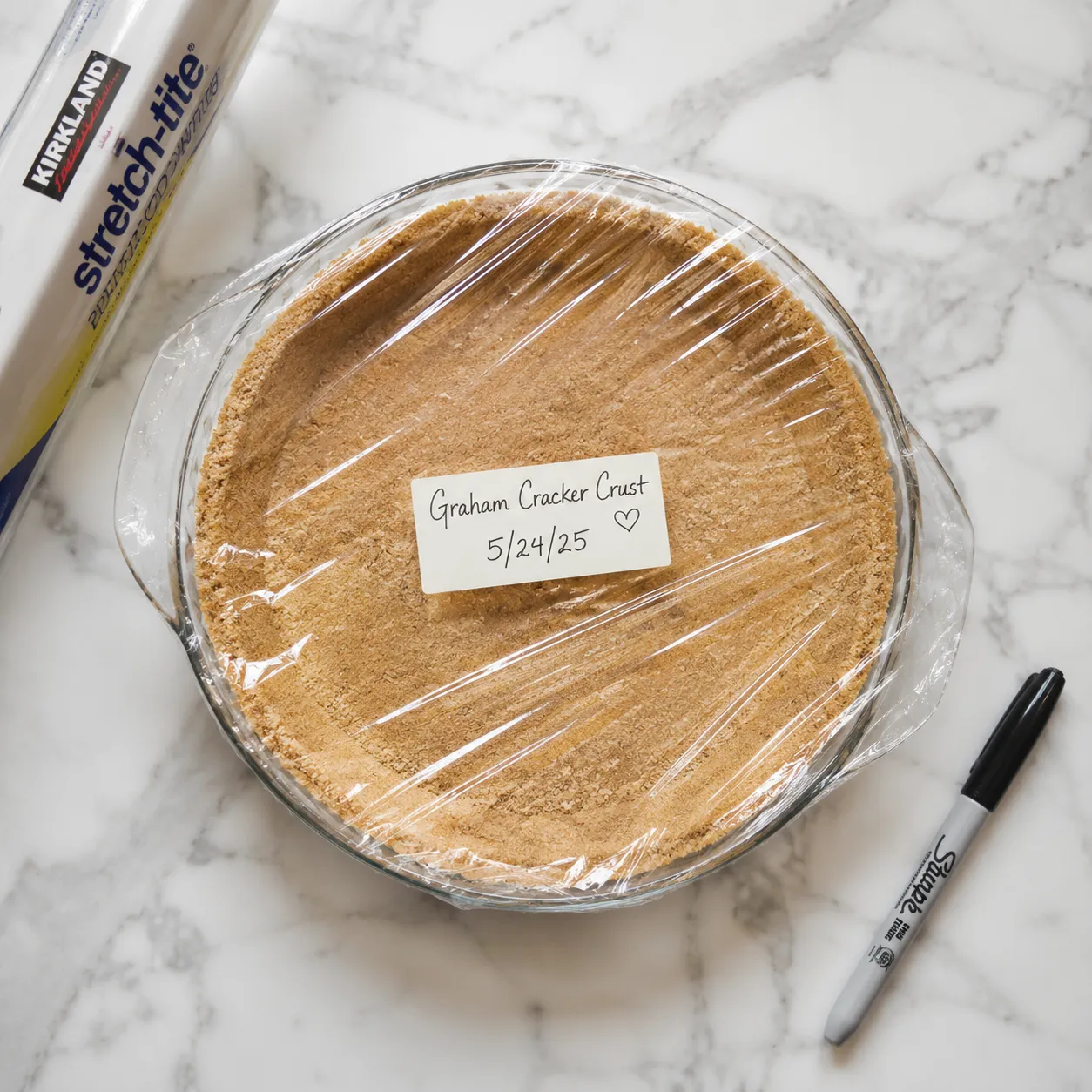 Make-ahead graham cracker crust wrapped for storage