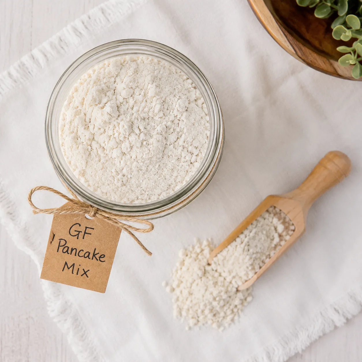 Homemade gluten free pancake mix in a glass jar with label