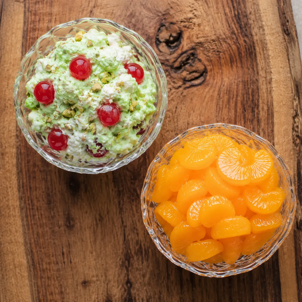 Variations of pistachio salad with cherries and mandarin oranges