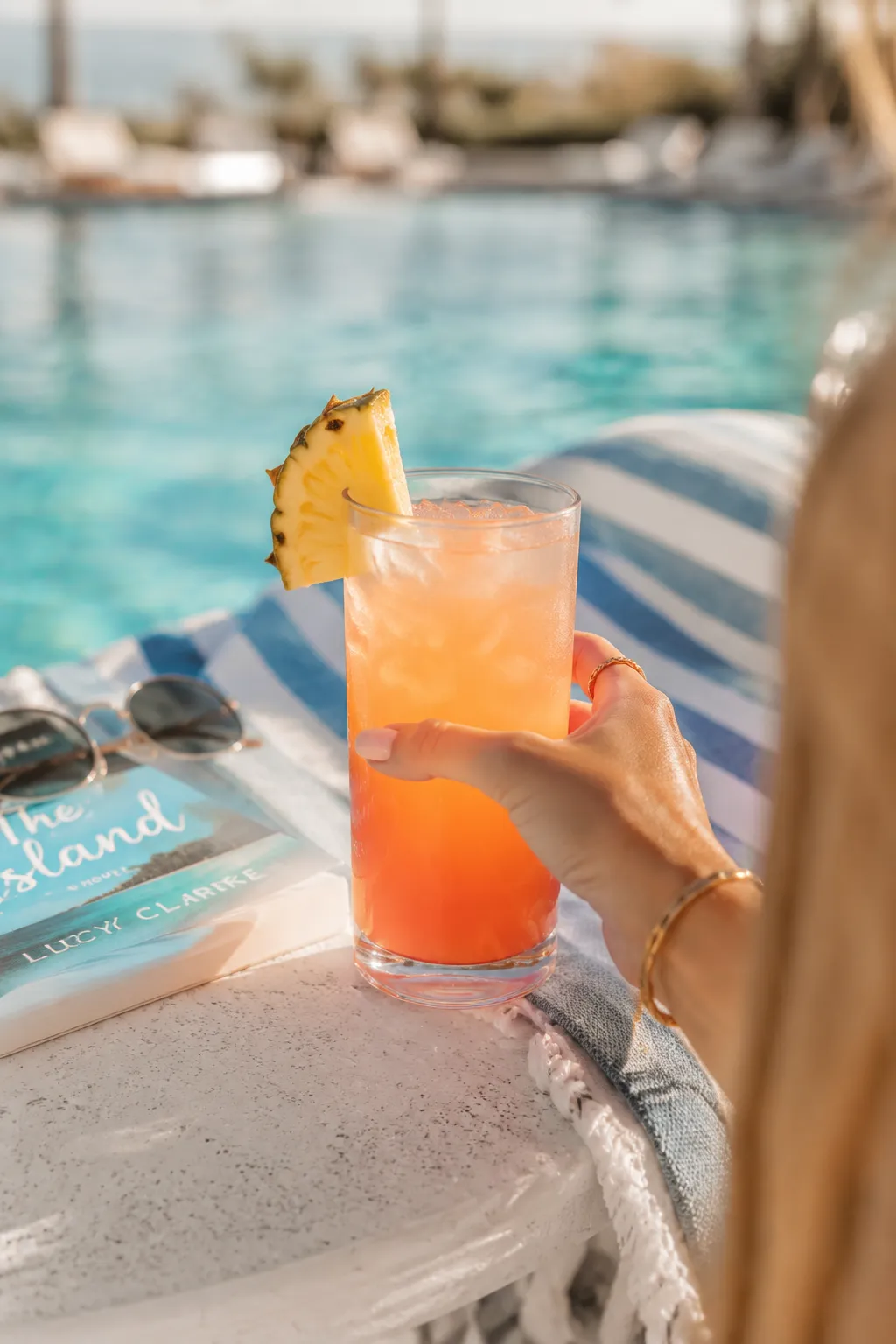 Enjoying a bay breeze drink poolside on a sunny afternoon