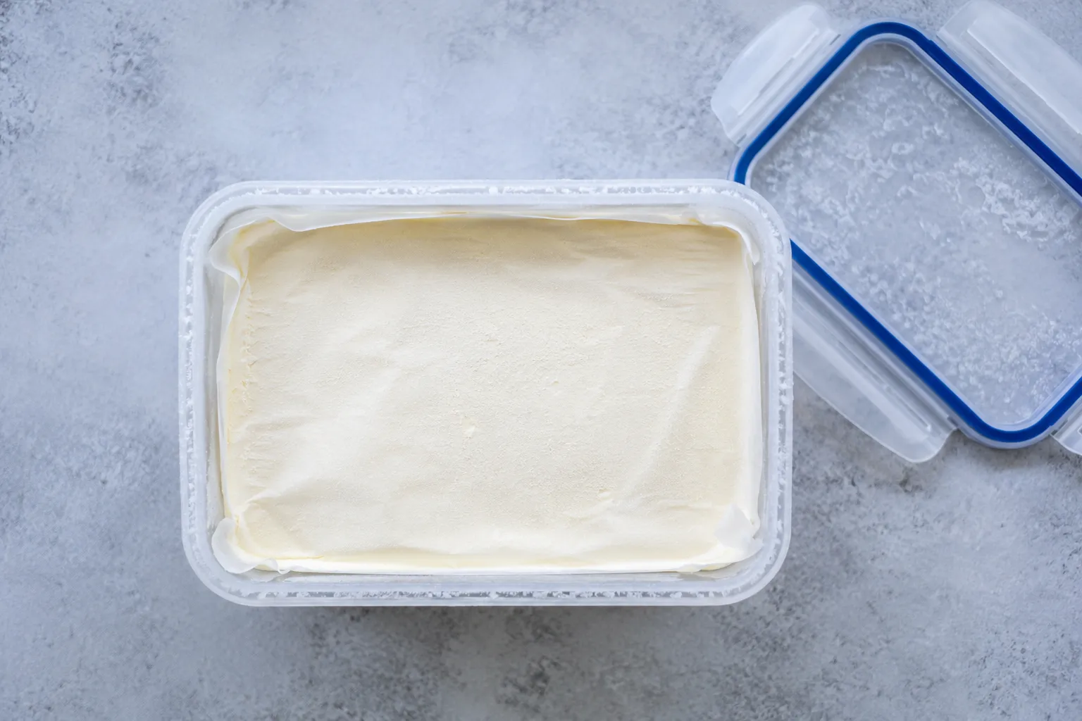 Storing homemade ice cream maker recipe in a freezer container