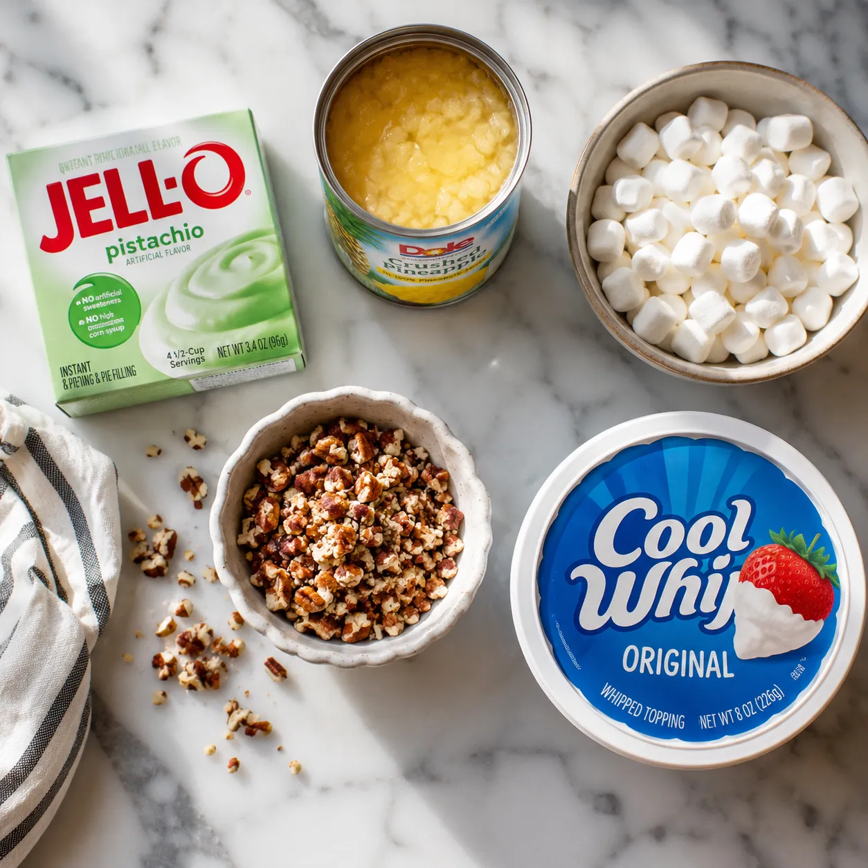 Ingredients needed for pistachio salad recipe: pudding mix, pineapple, marshmallows, pecans, whipped topping